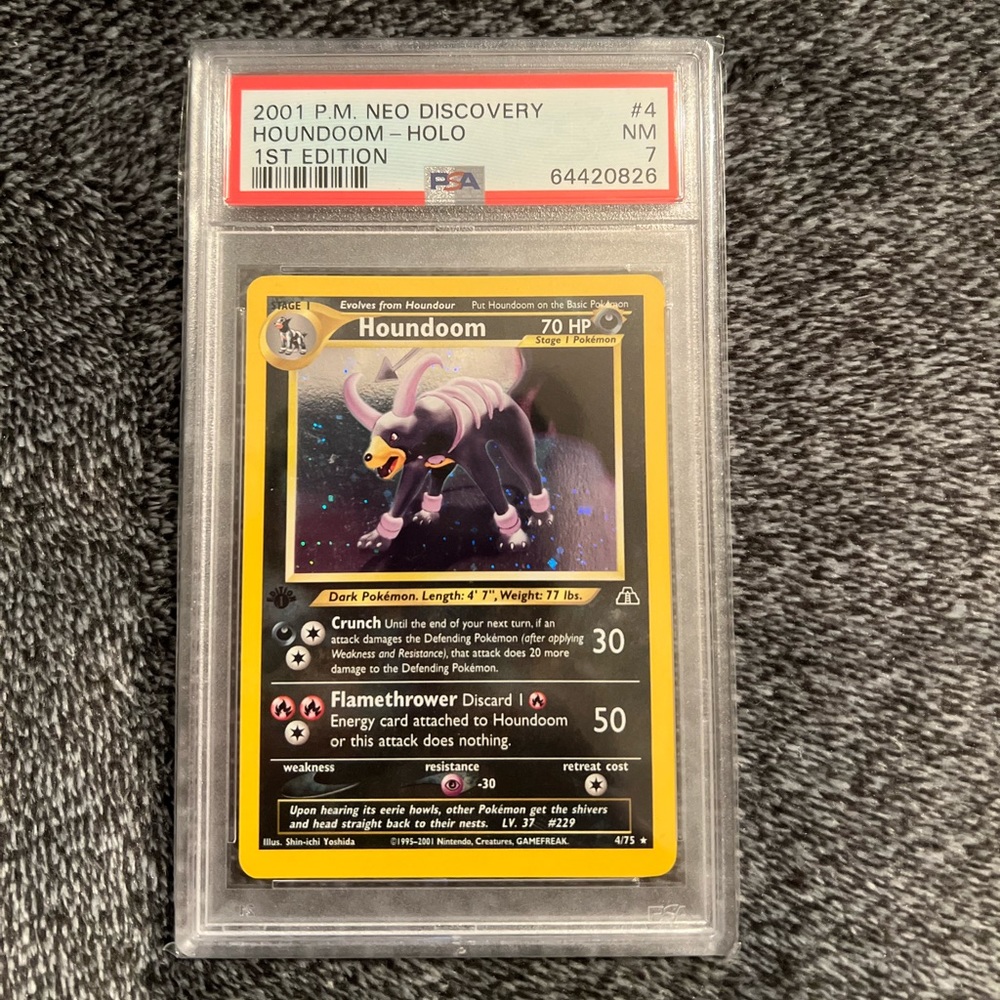 Pokémon Houndoom- Holo 1st Edition 4/75 2001
P.M. Neo Discovery PSA Rating: 7